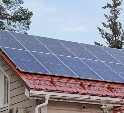 Technicians maintaining a hillside solar installation